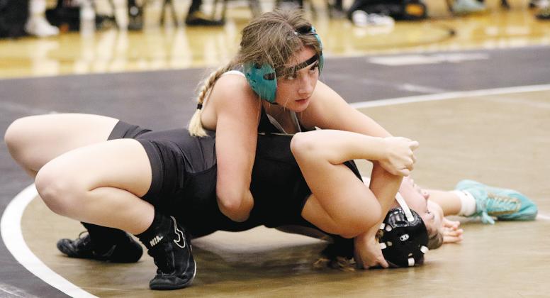 Claire Solansky works on a pinning move
