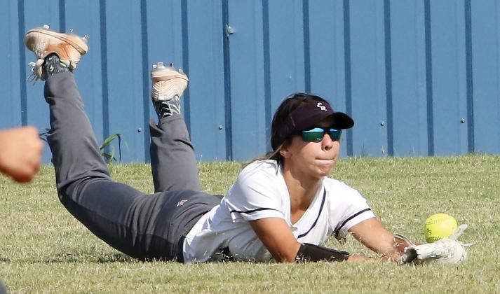 Krystiana Guzman dives to try and make a catch