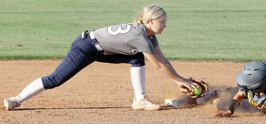 Jacy Little reaches out to make a tag on a Santa Fe South base runner
