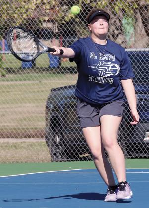 Serenity Billings reaches out to hit a forehand return shot