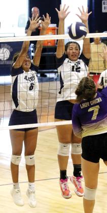 Kallie Mayfield and Anessa Woods attempt a double block