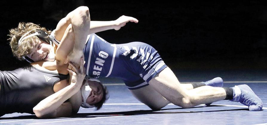 Brandon Harrison works on a pinning move