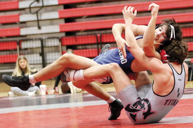 Trevor Robinson tries to turn into a reversal move during his match against Carl Albert