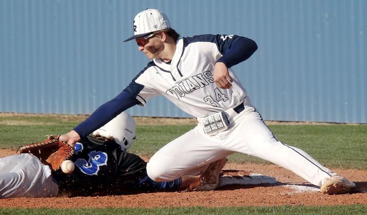 Mason Fulton uses his glove and a base runner to block a low pickoff throw