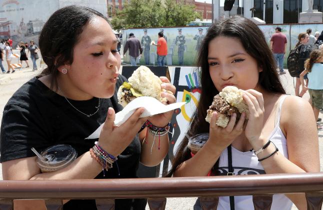 Emily Bowser (left) and Mya Levi take a bite of the Big Burger