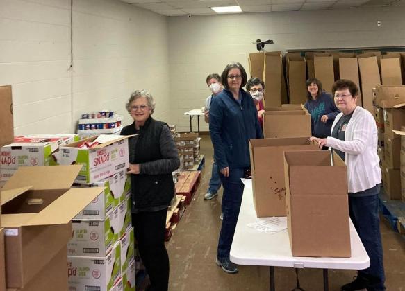 Volunteers boxed food last year for the Families with Children Food Program