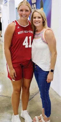 Emma Stover poses for a photo with OHS coach Haley Mitchell