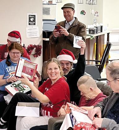 John Michalicka of Union City watches CFL residents open gifts