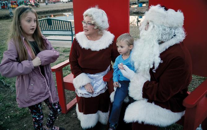 Meloni Norton tells Santa and Mrs. Claus what she wants for Christmas