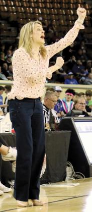 Haley Mitchel signals instructions to her players