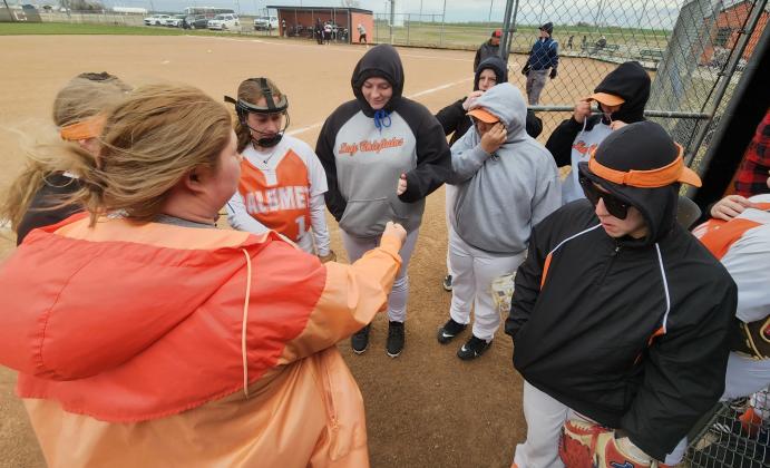 Calumet slow-pitch softball coach Karly Murray gathers her team