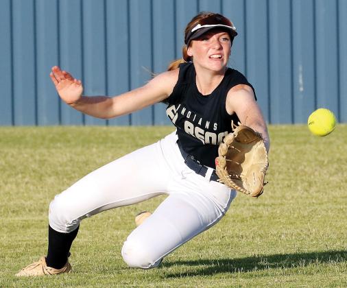 Maddie Moss dives forward as she tries to make a catch
