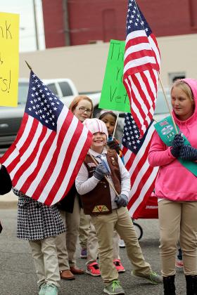 Girl Scouts with American flags