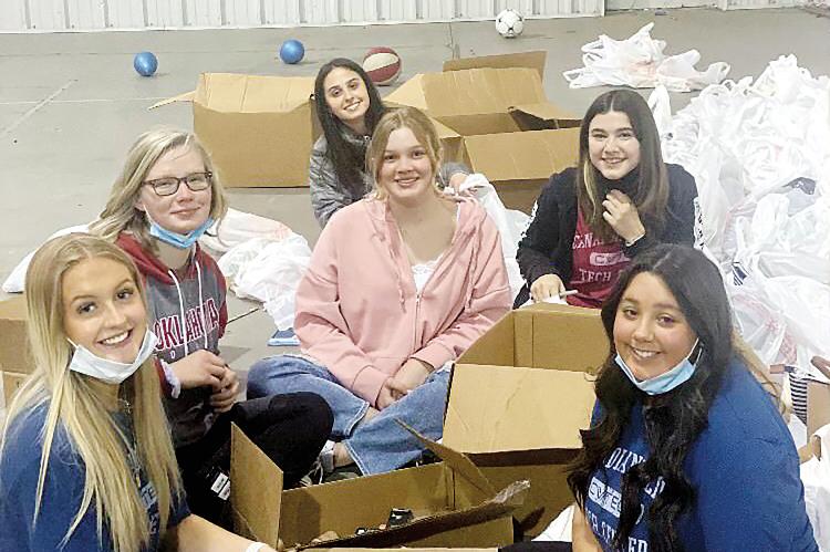 Health Career students from CVTC helped fill boxes