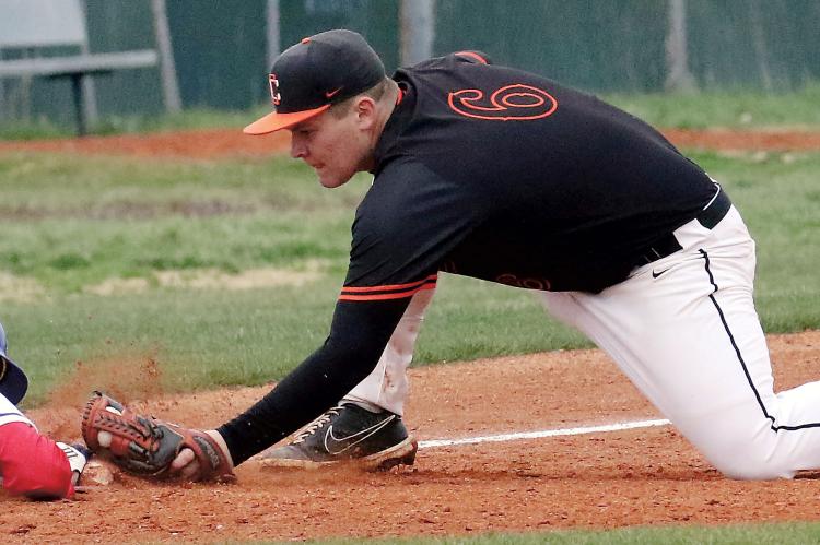 Carson Cooper reaches out to tag a Southwest Covenant School base runner