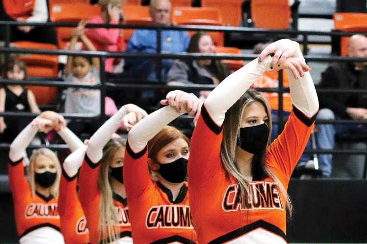 Calumet High School cheerleaders hold a pose during a recent basketball game