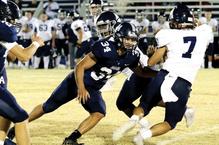 Mikey Devereaux forces an Altus ball carrier to change directions