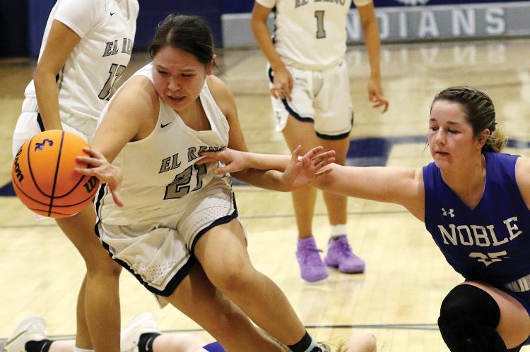 EHS girls basketball_Sioux steps through two defenders