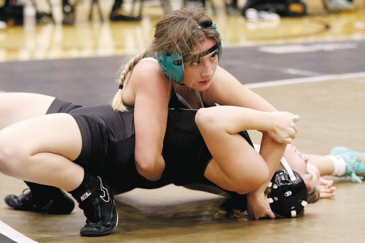 Claire Solansky works on a pinning move
