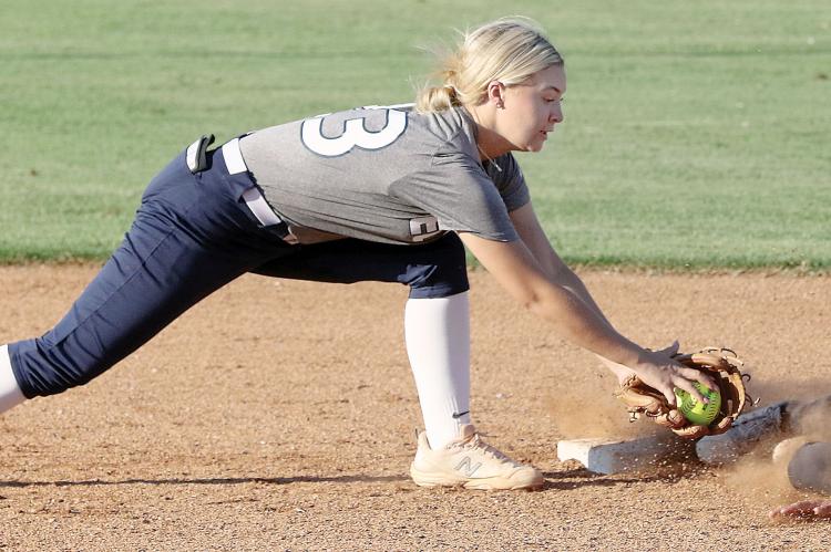 Jacy Little reaches out to make a tag on a Santa Fe South base runner