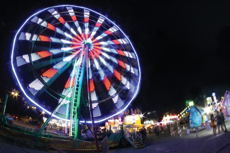 The colors of the carnival rides popped in the night sky