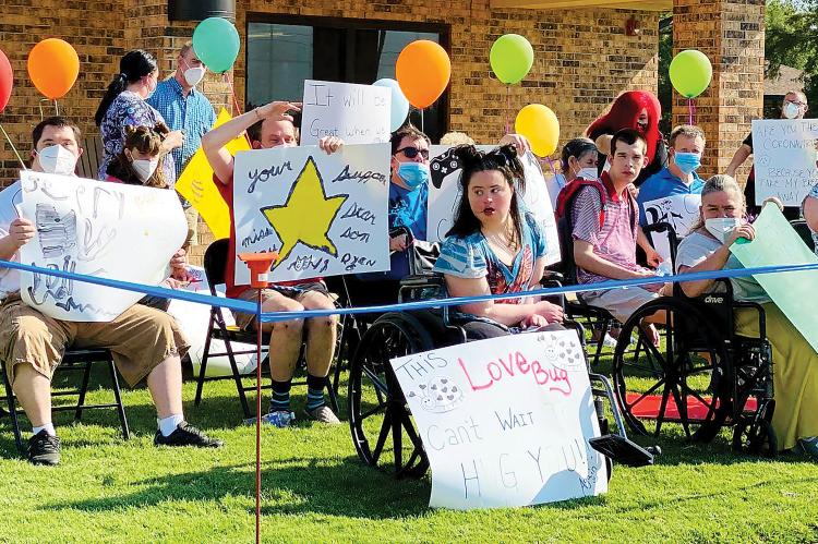 Residents at the CFL held a drive-by parade with signs for family