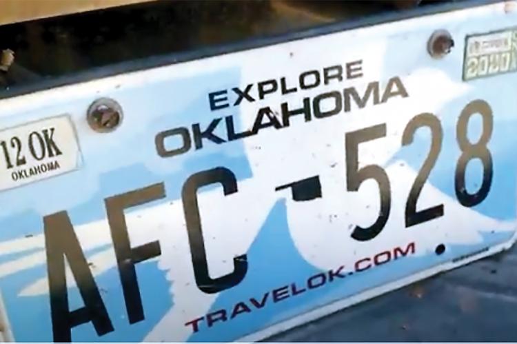A photo of a stolen Oklahoma license plate