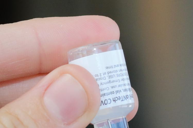 A syringe being filled with the COVID-19 Pfizer vaccine