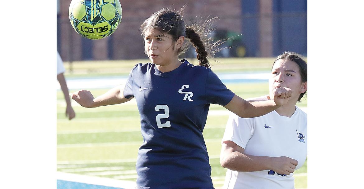 Sinthia Puebla (2) uses her upper body to control a pass from a teammate_slideshow